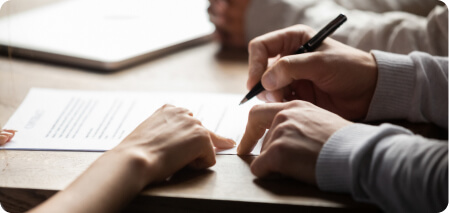 Two people engage in a document signing